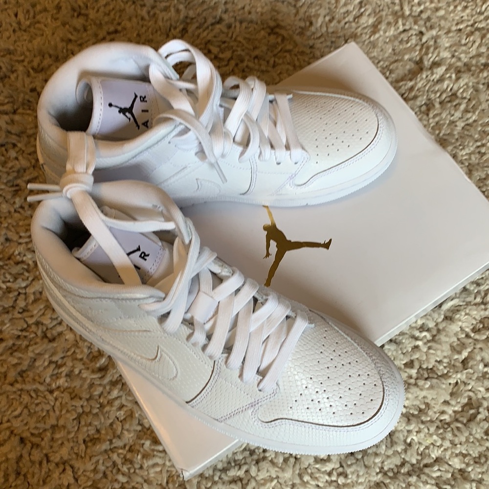 Brand new in box Air Jordan 1 Mid, size 7 women’s
